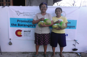 Typhoon Nona victims as they receive relief goods from PCCED Relief Operation in Barcelona, Sorsogon.